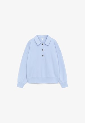 Light blue long-sleeve polo shirt with a collar and three dark buttons on the placket, ribbed cuffs, and a relaxed fit.