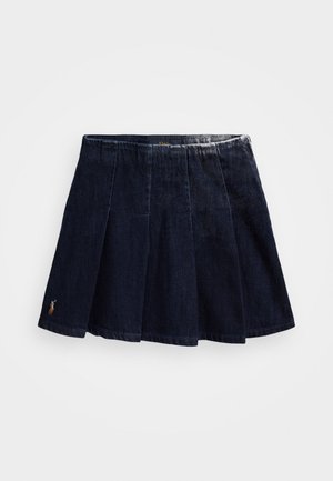 Tumesinise denimi seelik plekkide kujundusega. Omab elastset vöökohta ja väikest broderi logot allääres.