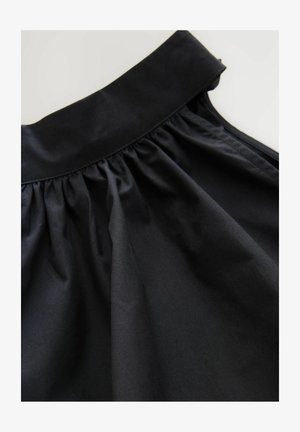Black midi skirt made of smooth, lightweight fabric. Features a gathered waistband, flowing silhouette, and a subtle sheen.