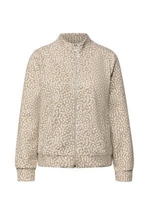 Beige vadderad jacka med ett texturerat mönster, hög krage, dragkedja framtill och ribbade ärmslut. Har en avslappnad passform och slät foder.