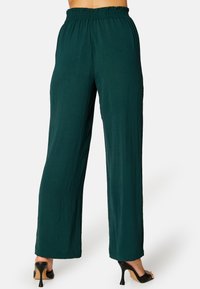 Bubbleroom SMOCK WAIST WIDE TROUSERS - Broek - dark green