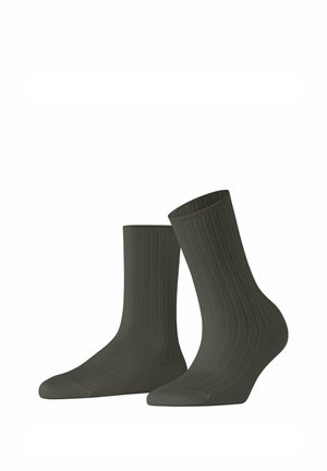 Chaussettes vert foncé à côtes, avec une texture lisse, longueur classique et orteils renforcés pour plus de durabilité.