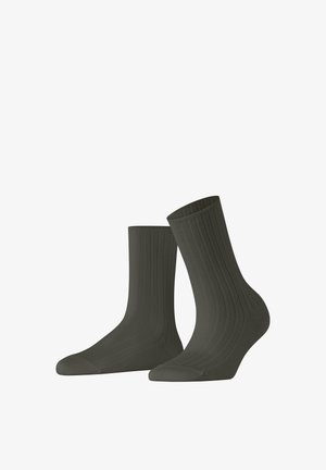 Donkergroene geribbelde sokken met een gladde textuur, voorzien van een crew-lengte en verstevigde teen voor duurzaamheid.