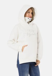 White hooded sweatshirt with a front pocket, featuring a stitched "Usy Legendary" design. Smooth texture, relaxed fit, and side slits.