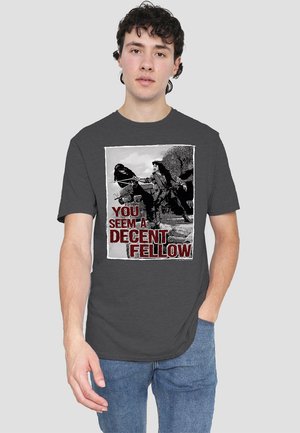 Gray cotton t-shirt featuring a graphic print with two characters in black and white, captioned "YOU SEEM A DECENT FELLOW" in red.