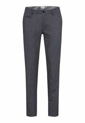 Pantaloni tailored grigio scuro con una vestibilità slim, tessuto strutturato e tasche frontali. Presentano una zip frontale e una chiusura con bottone in vita.