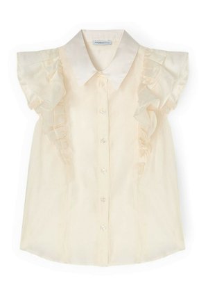 Crèmekleurige mouwloze blouse met gerafelde details langs de schouders en knoopsluiting aan de voorkant, met een klassieke puntkraag.