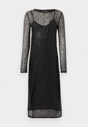 Musthave must-valge pikkade varrukatega kleit, millel on sobiv sisemine kiht ja läbipaistev pitskiht. Omab tekstuurmustrit ja peent sära kogu pinnal.