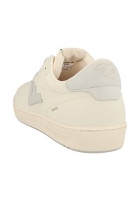 Sneakers with a cream leather upper, suede heel accent, grey logo, and textured rubber sole. Features a minimalistic design and clean lines.