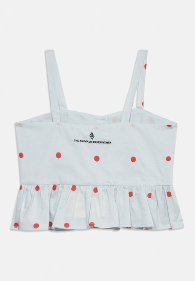 Λευκό κοντό τοπ χωρίς μανίκια με λεπτές τιράντες, κόκκινες πουά, βολάν στο τελείωμα και το λογότυπο "The Animals Observatory" στο κέντρο του στήθους.