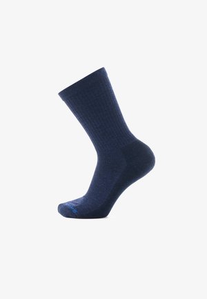 Calzino a coste blu navy con tallone e punta rinforzati, caratterizzato da una texture sottile. Materiale leggero. Senza motivi o grafica visibili.