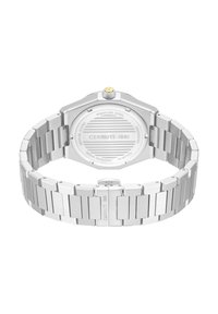 Reloj de acero inoxidable con caja octagonal, acabado plateado y pulsera de eslabones. Cuenta con un fondo recubierto de zafiro y resistencia al agua.