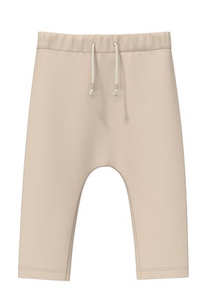 Beige, verkürzte Sweatpants aus weichem Material. Mit elastischem Bund und Kordelzug sowie einer lässigen Passform. Keine Muster oder Akzente.