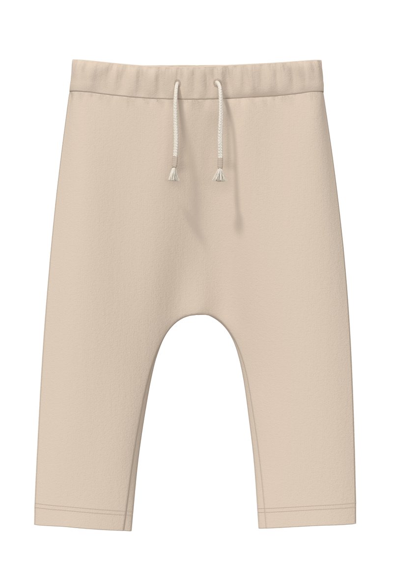 Beige cropped sweatpants van zacht materiaal. Heeft een elastische tailleband met koordjes en een ontspannen pasvorm. Geen patronen of accenten.
