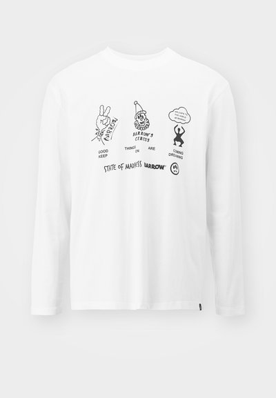 T-shirt à manches longues blanche ornée de graphismes noirs, incluant du texte et des dessins de style cartoon, positionnés sur le devant.