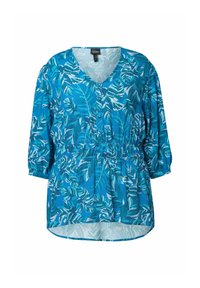 Blusa teal con motivi a foglia bianchi, scollo a V, maniche a tre quarti e vita elasticizzata. Tessuto liscio con vestibilità comoda.