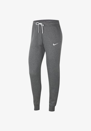 Tmavě šedé tepláky Nike s zúženými nohavicemi, elastickým páskem, bílým stahovacím šňůrkem a bílým logem Nike Swoosh na levém stehni.
