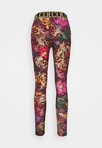 Sheer leggings with a multicolor floral pattern in purple, red, and green. Features a black and gold patterned waistband.