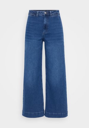 High-waisted wide-leg jeans in medium blue denim, featuring a button closure, belt loops, and a clean hem with no distressing.