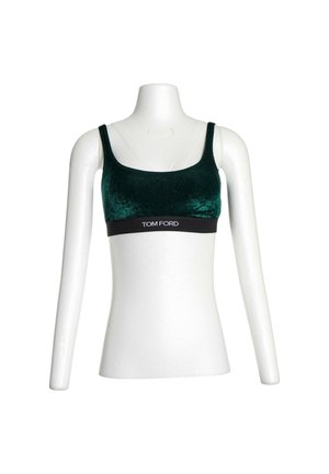 Crop top en velours vert foncé avec bande élastique noire et logo blanc "TOM FORD" sur un buste de mannequin blanc.