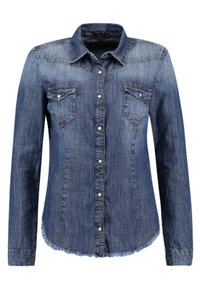 Denimskjorta med långa ärmar, en spetsig krage och två bröstfickor. Tyget är i en medelblå nyans med urtvättade detaljer och fransad nederkant.