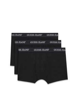 Tre boxer neri da uomo impilati, ognuno con una fascia elastica nera con testo bianco "GUESS JEANS".