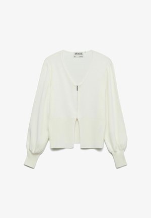 Cardigan blanc à manches longues avec col en V, fermeture éclair centrale et larges bordures côtelées aux poignets et à l'ourlet.