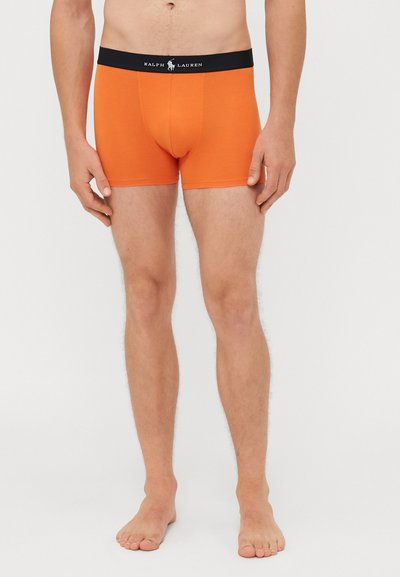 Boxer shorts de algodão laranja com um cós elástico preto com o logotipo "RALPH LAUREN". O design ajustado vai até a metade da coxa.