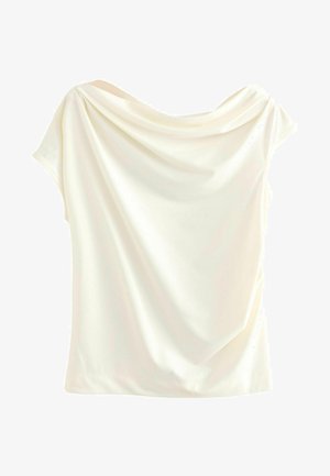 Rippuv heledal bluus lühikeste varrukatega, millel on pehme ja sile tekstuur ning lõtv lõige. Ei ole nähtavat riistvara ega mustreid.