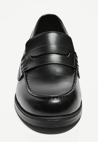 Black leather loafers with a smooth finish, a decorative strap across the upper, and a rounded toe. Features subtle stitching and a sturdy sole.