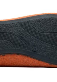 Black rubber sole with textured grip pattern, orange felt layer visible at the edge, marked size 43, "Made in Spain" imprint.