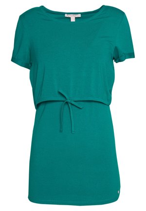 Krótka bluzka ciążowa w kolorze morskim z okrągłym dekoltem i troczkiem pod biustem, umożliwiającym regulację dopasowania.