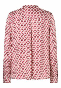 Long-sleeve shirt in white fabric with a red geometric pattern. Features a back pleat, collar, and buttoned cuffs for closure.