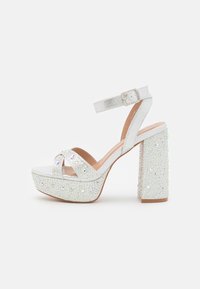 Korolliset sandaalit - silver