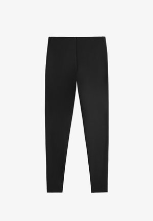 Schwarze Leggings mit glatter Textur, figurbetonter Form und elastischem Bund. Keine Muster oder Beschläge; minimales Design.