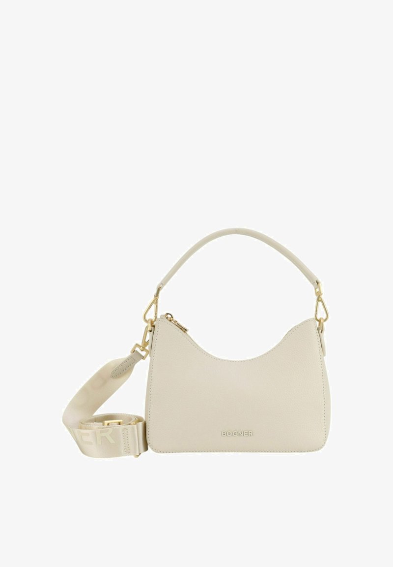 Beige nahkalaukku, jossa on kaareva muotoilu, irrotettava olkahihna, kullatut yksityiskohdat ja vetoketjukiinnitys. Brändin nimi on kohdistettu etupuolelle.