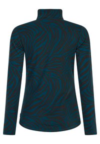 Top de manga larga con un cuello alto, con un patrón de rayas de cebra en azul y negro sobre una tela suave y elástica.