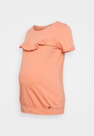 T-shirt de maternidade em cor pêssego, com mangas curtas, apresenta um detalhe franzido na decote, feita de algodão suave, com uma bainha curvada.