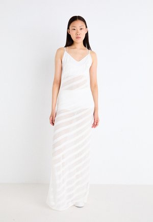 White maxi dress with thin straps, featuring a sheer layered design and horizontal stripes. Smooth texture with a lightweight appearance.