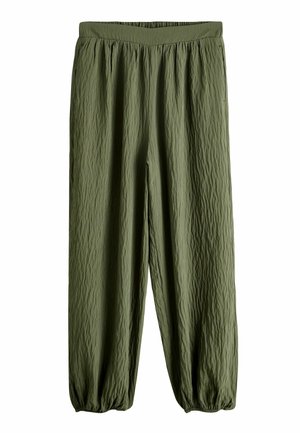 - Spodnie materiałowe