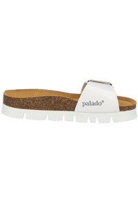 White slide sandal with a cork footbed, textured grip sole, and a metallic buckle detail. Brand logo "palado" printed on the strap.