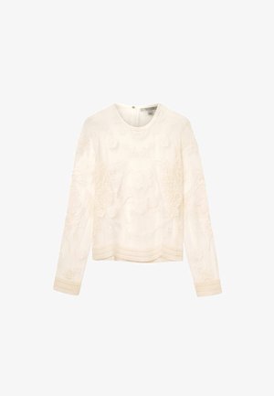 Hvid langærmet top med detaljeret blomsterbroderi, tekstureret stof, rund halsudskæring og dekorativ kantdetalje ved kanten.