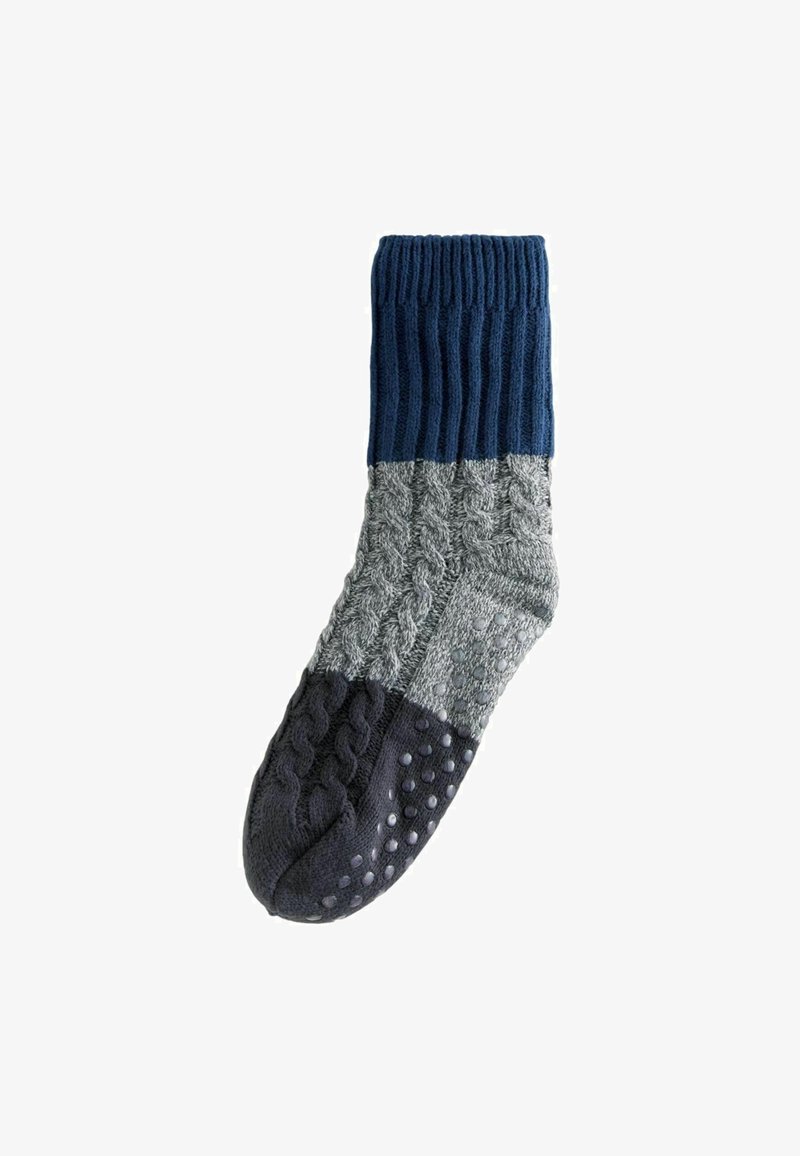 Calzini di crew lavorati a maglia con sezioni blu navy, grigio e grigio scuro. Dettagli testurizzati e puntini in gomma sulla suola per una migliore aderenza.