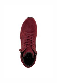Burgundy suede boot with a rounded toe, front laces, and side zippers. Smooth interior lining and textured outer surface.