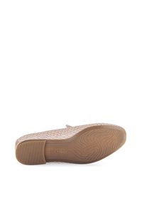Light beige slip-on shoe with woven fabric upper, cushioned insole, and a textured rubber sole. Gabor logo visible on the outsole.