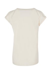 Light beige short-sleeve t-shirt with a round neckline, featuring a smooth texture and a relaxed fit. No visible patterns or accents.