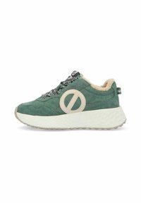 Green suede sneaker with a beige logo detail, textured white outsole, black patterned laces, and a plush tan collar.