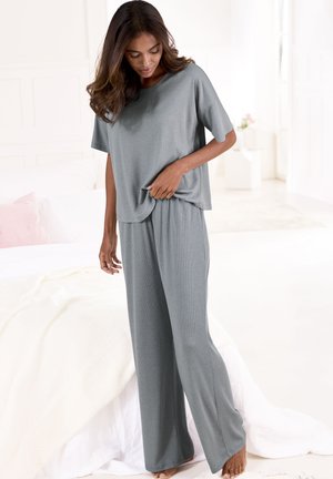 Light gray pajama set featuring a loose-fitting, short-sleeved top and wide-leg pants, made from soft, textured fabric.