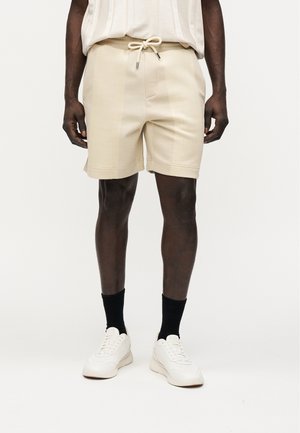 HUXLEY - Pantalones deportivos - light beige