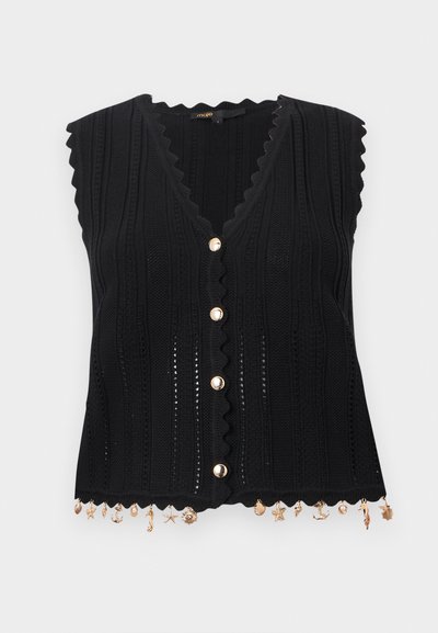 Μαύρο αμάνικο πλεκτό τοπ με κυματιστά τελειώματα, χρυσά κουμπιά στο μπροστινό μέρος και μικρά χρυσά θαλασσινά μοτίφ που κρέμονται από το τελείωμα.